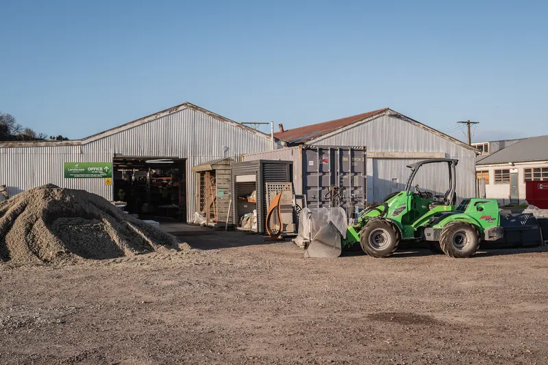 The yard loader at BuildLink Timaru, parked in front of the sheds