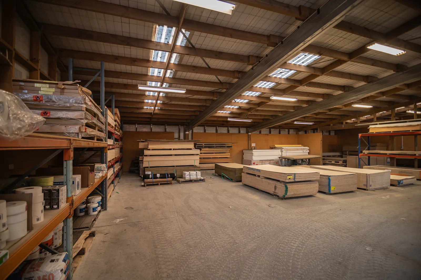 Inside the BuildLink Timaru warehouse, with sheet material stacked on the floor
